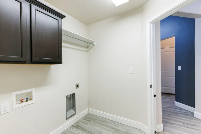 a view of hallway with wooden floor