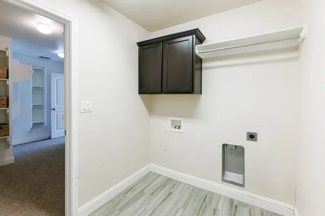 a view of hallway with wooden floor