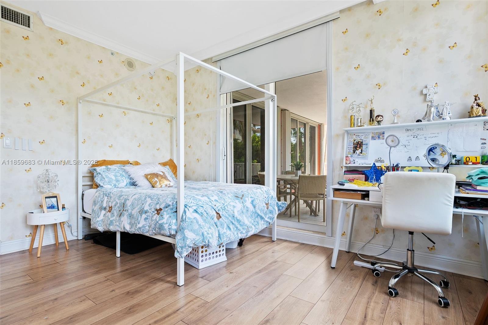 781 Crandon Boulevard, Unit 306 Key Biscayne, FL 33149 - Photo 19 of 32 a bed room with a bed and a chair