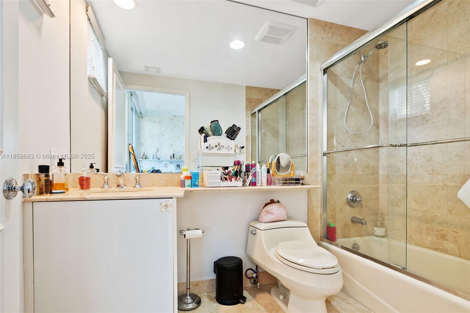 781 Crandon Boulevard, Unit 306 Key Biscayne, FL 33149 - Photo 20 of 32 a bathroom with a sink toilet and shower