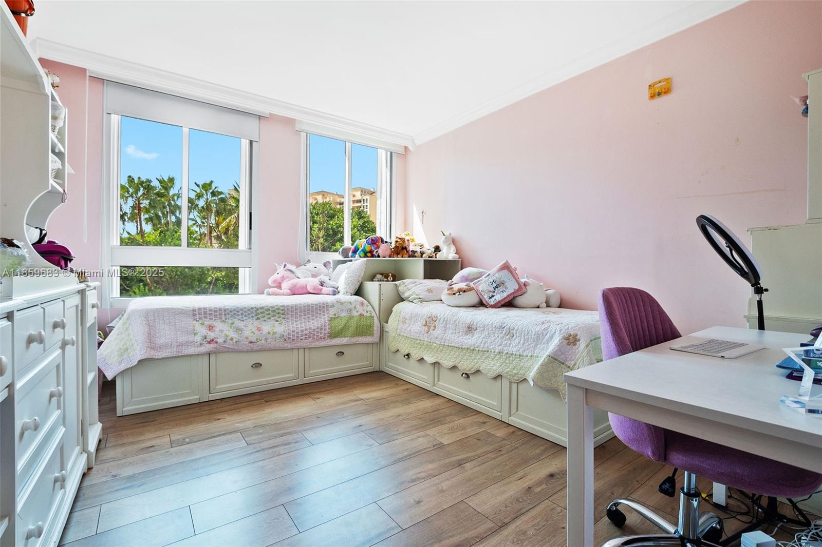 781 Crandon Boulevard, Unit 306 Key Biscayne, FL 33149 - Photo 21 of 32 a bedroom with a bed and a window