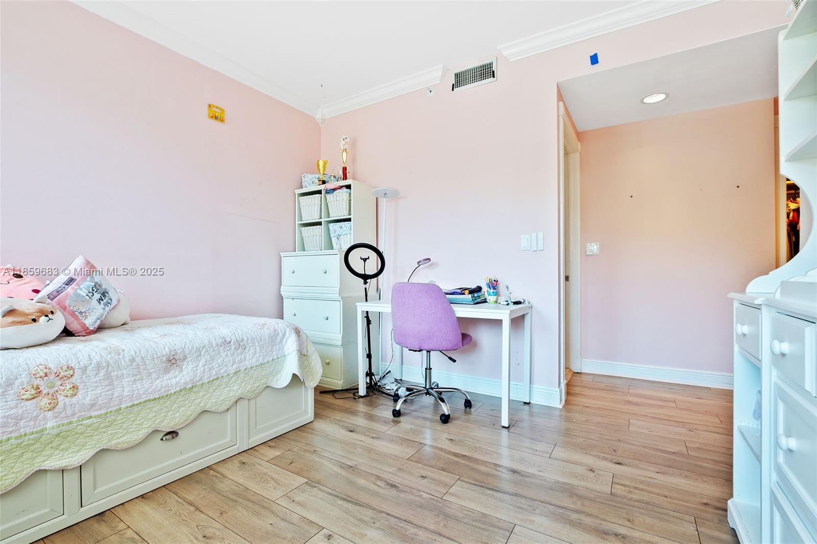 781 Crandon Boulevard, Unit 306 Key Biscayne, FL 33149 - Photo 22 of 32 a bedroom with a bed and wooden floor