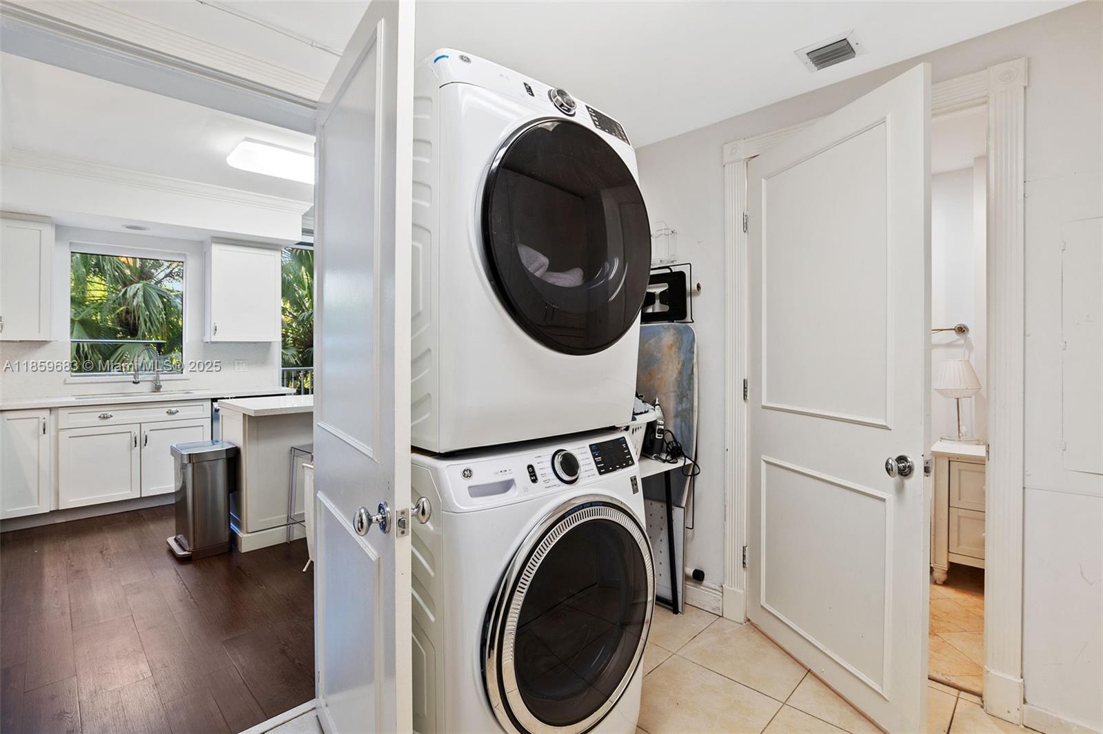 781 Crandon Boulevard, Unit 306 Key Biscayne, FL 33149 - Photo 28 of 32 a view of a hallway with washer and dryer