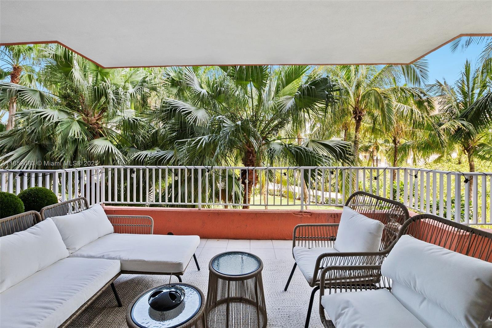 781 Crandon Boulevard, Unit 306 Key Biscayne, FL 33149 - Photo 30 of 32 a view of a chairs and table in patio