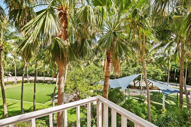 a view of a chair and tables in the balcony