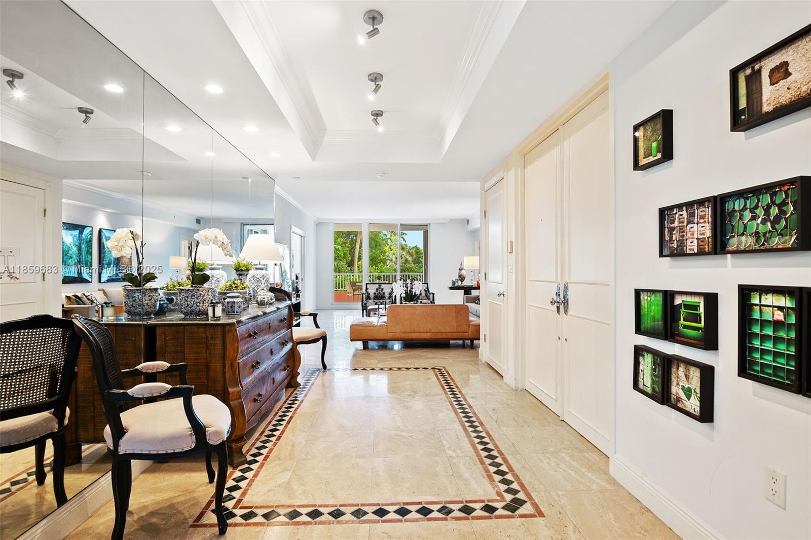 781 Crandon Boulevard, Unit 306 Key Biscayne, FL 33149 - Photo 5 of 32 a living room with furniture and a rug