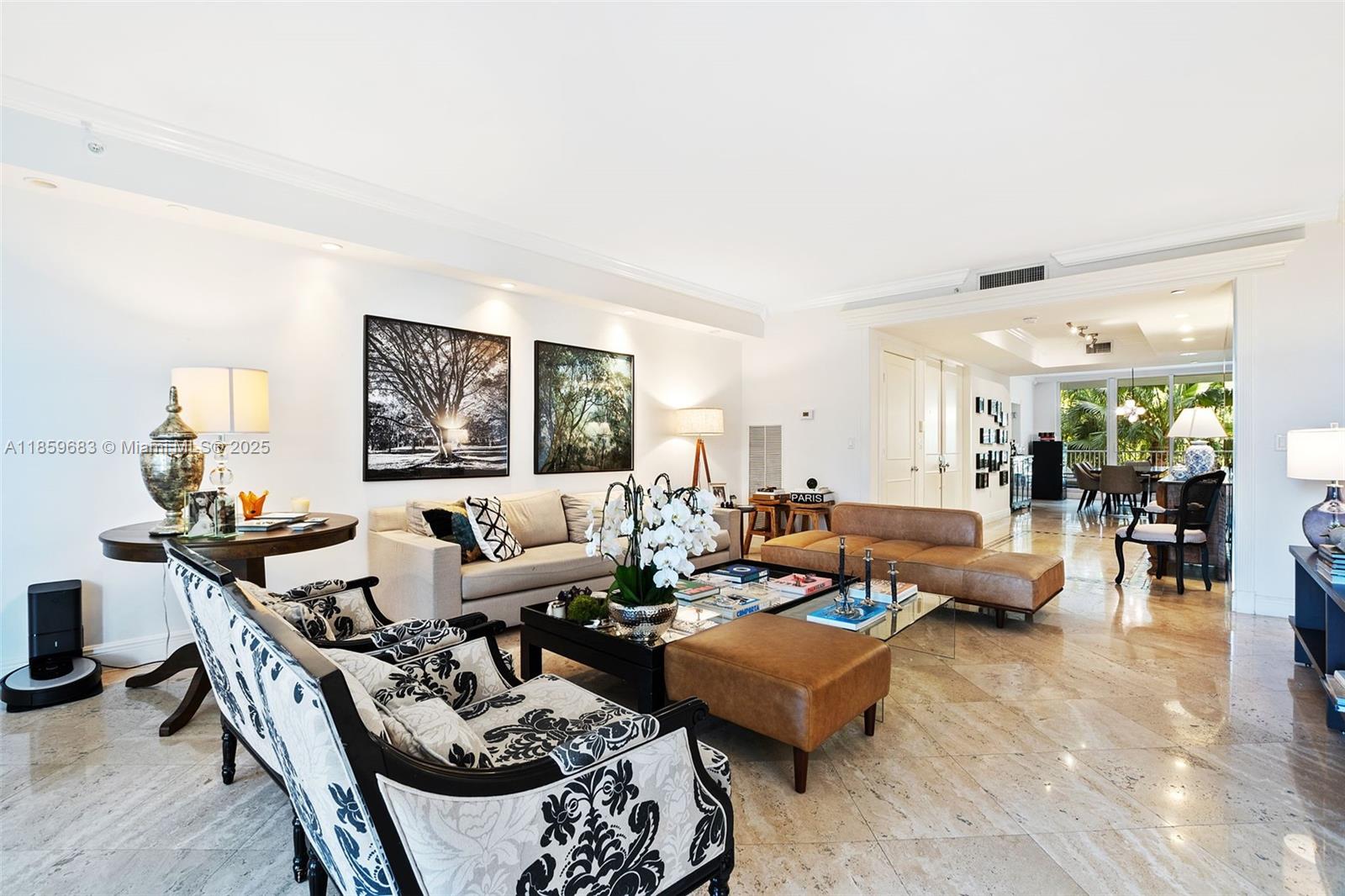 781 Crandon Boulevard, Unit 306 Key Biscayne, FL 33149 - Photo 9 of 32 a living room with furniture and a large window