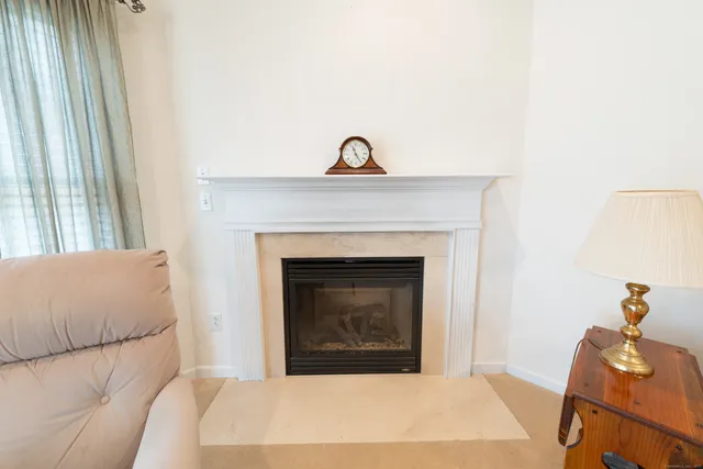 a bedroom with a bed and a fireplace