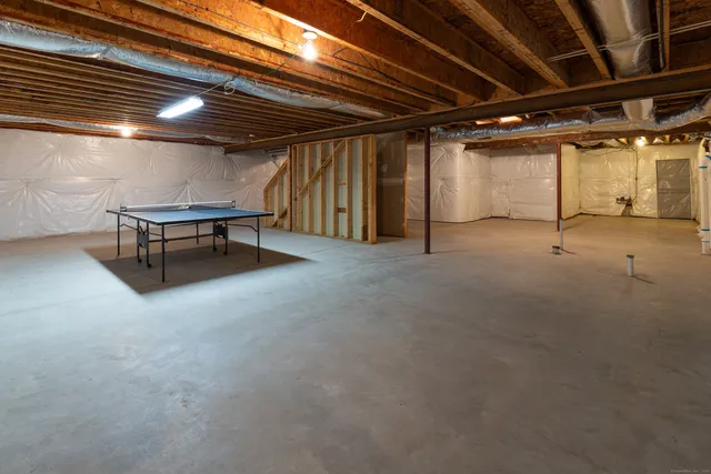 a view of empty room with wooden walls