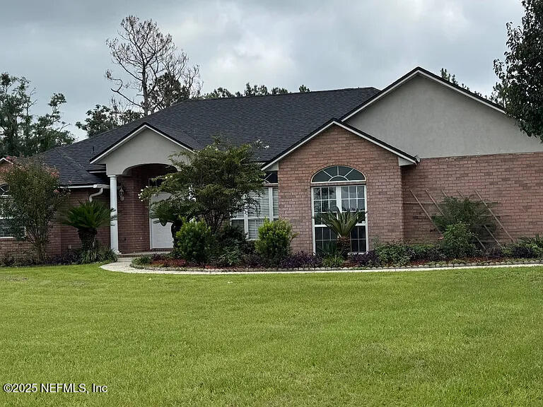 a front view of a house with a yard