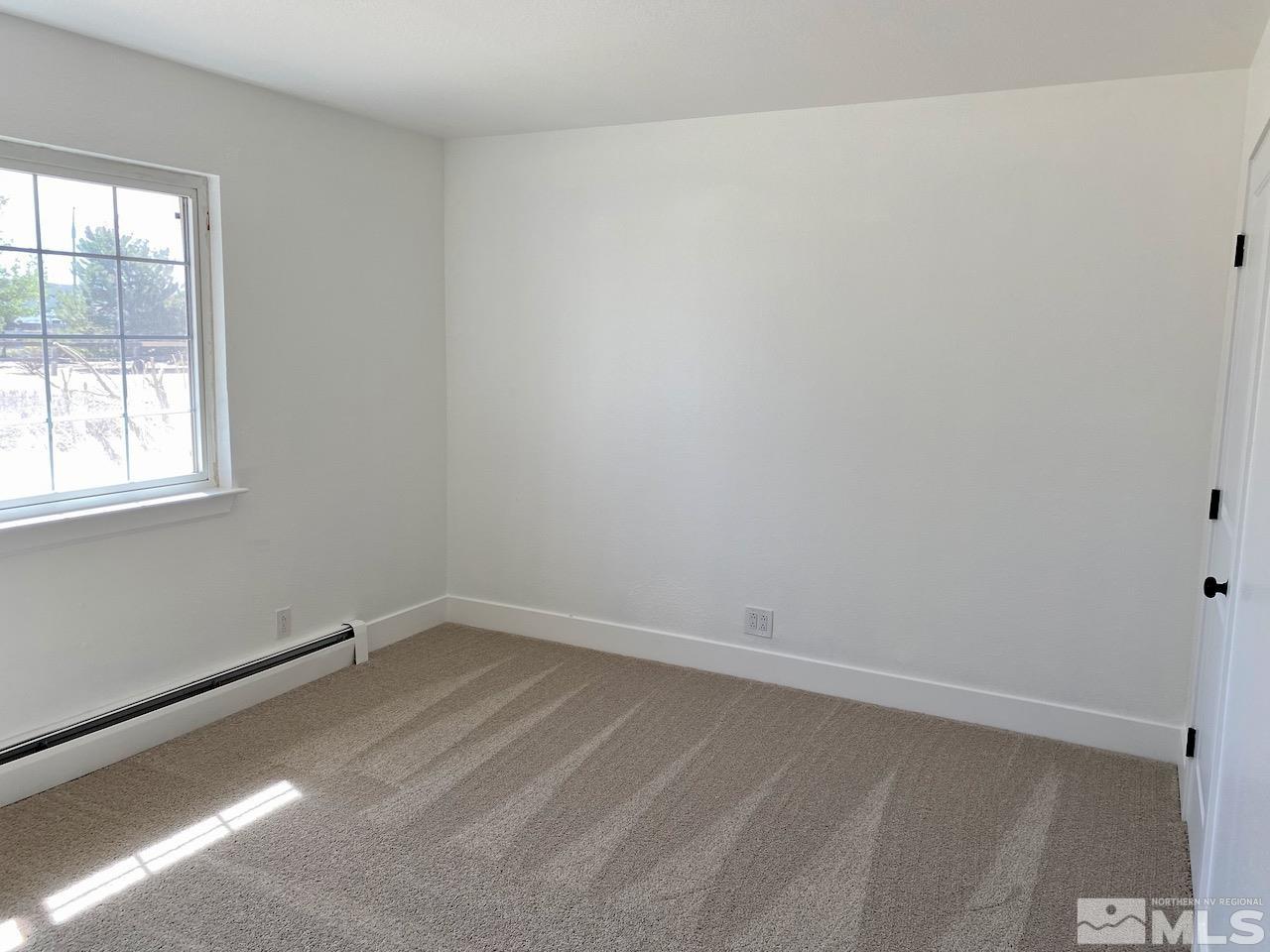 10775 Osage Road Reno, NV 89508 - Photo 11 of 22 an empty room with a window
