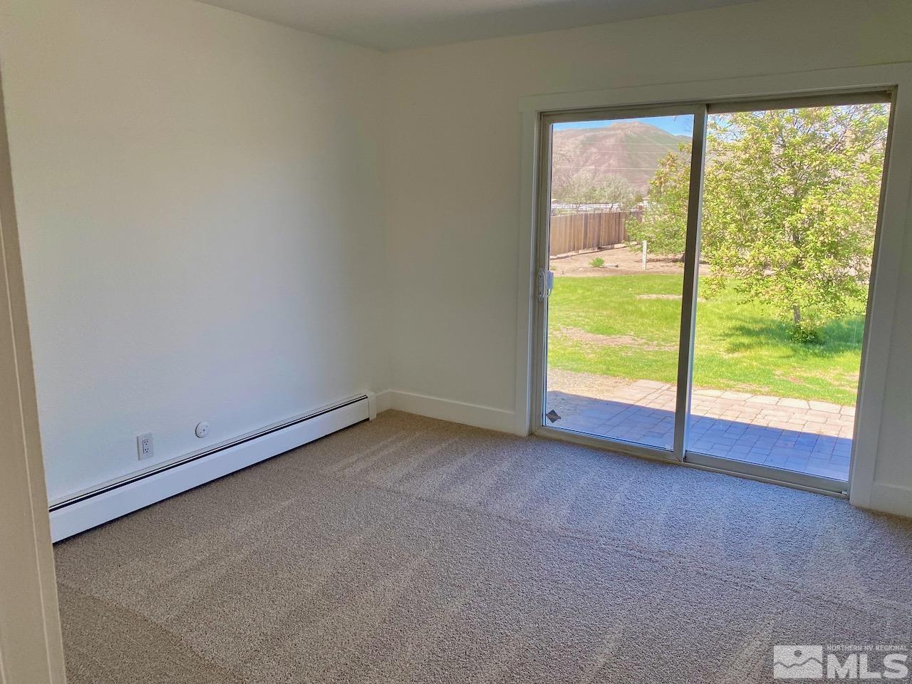 10775 Osage Road Reno, NV 89508 - Photo 13 of 22 a view of an empty room with a floor to ceiling window
