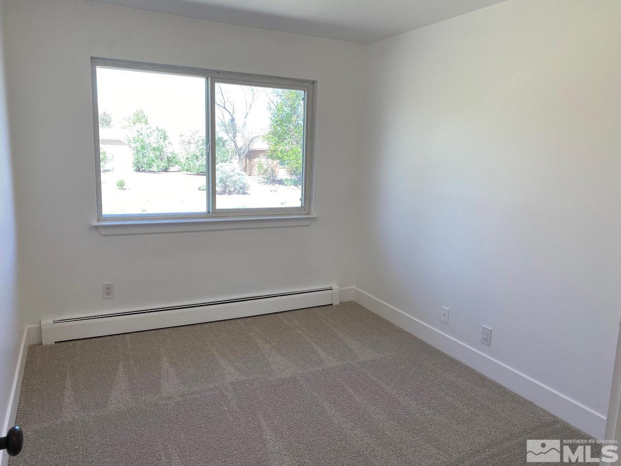 10775 Osage Road Reno, NV 89508 - Photo 14 of 22 an empty room with a window