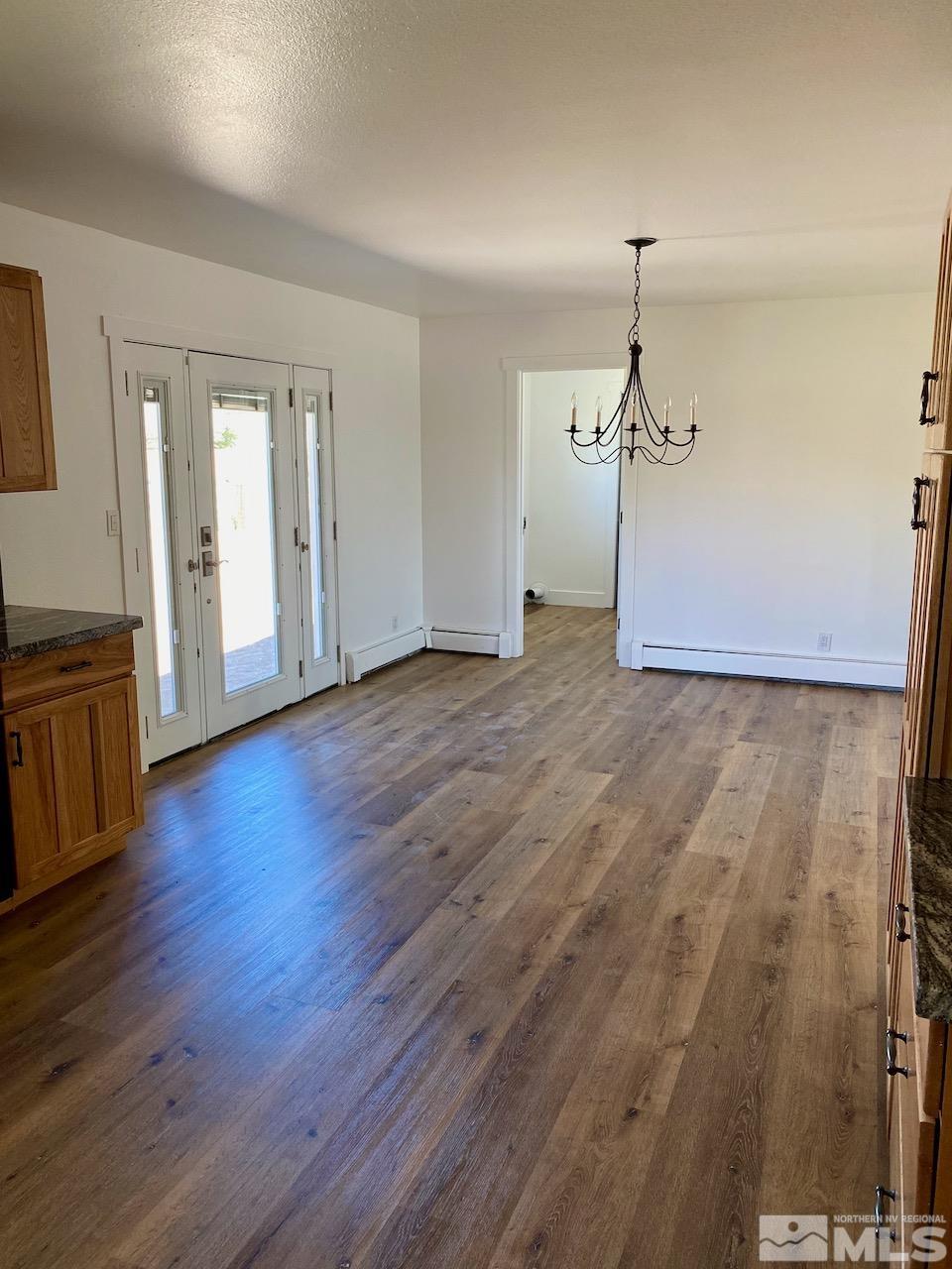 10775 Osage Road Reno, NV 89508 - Photo 16 of 22 a view of empty room with wooden floor
