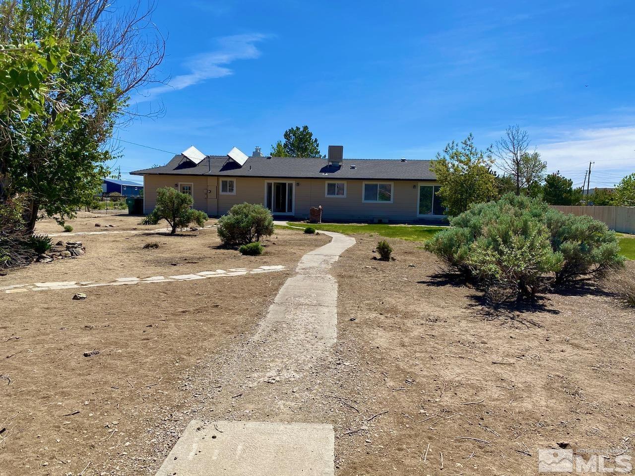 10775 Osage Road Reno, NV 89508 - Photo 21 of 22 a view of a house with backyard and sitting area
