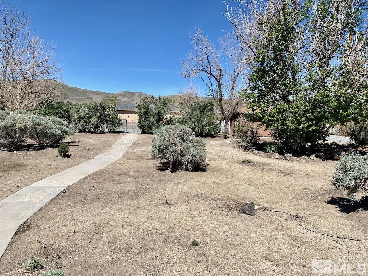 10775 Osage Road Reno, NV 89508 - Photo 22 of 22 a view of a road with a yard