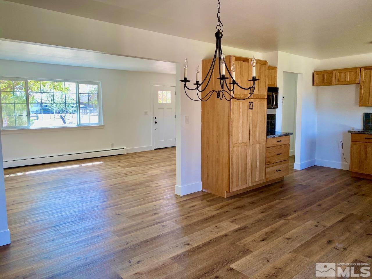 10775 Osage Road Reno, NV 89508 - Photo 4 of 22 a view of a livingroom with wooden floor staircase and a living room