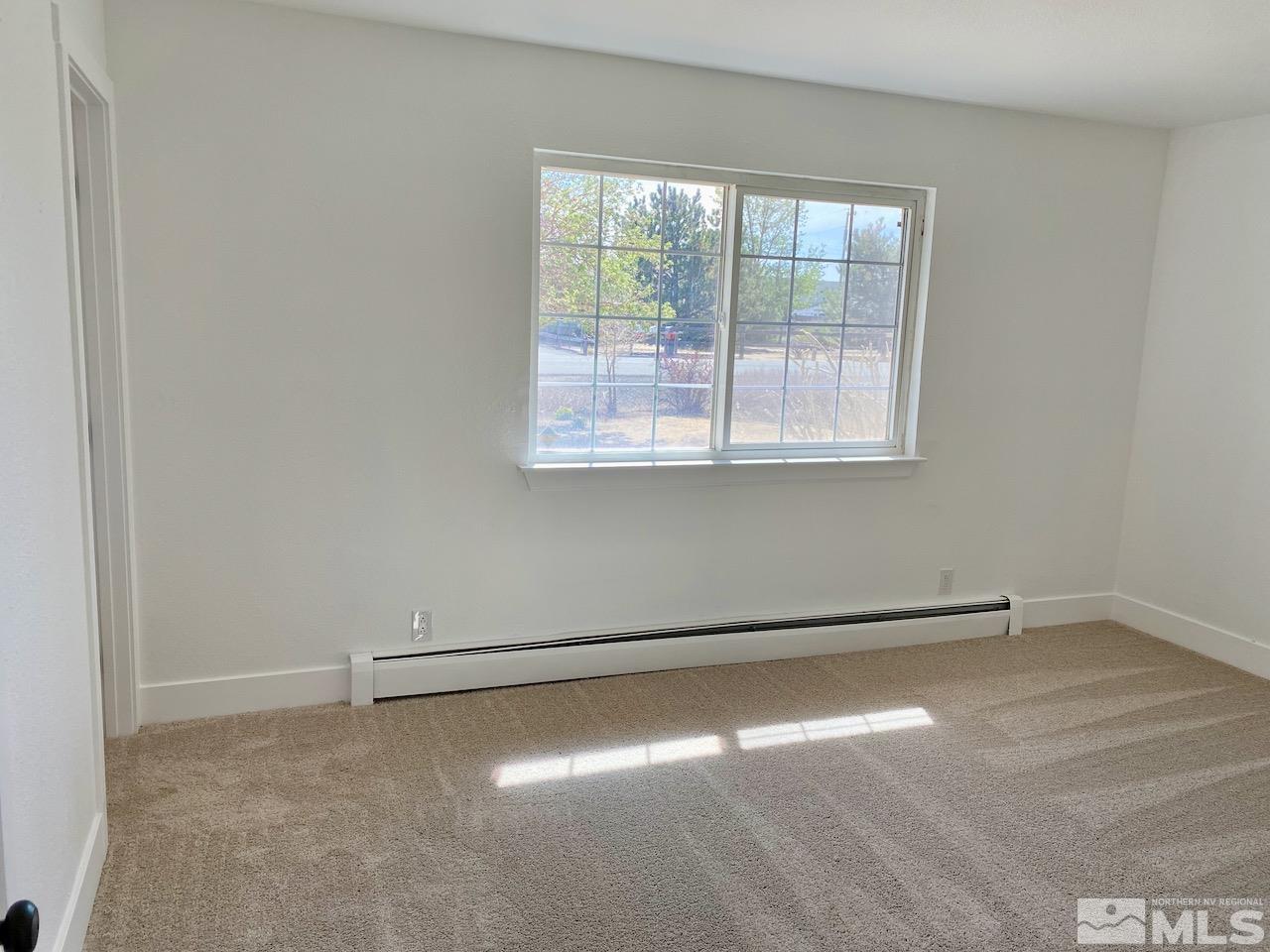10775 Osage Road Reno, NV 89508 - Photo 10 of 22 an empty room with a empty space and window