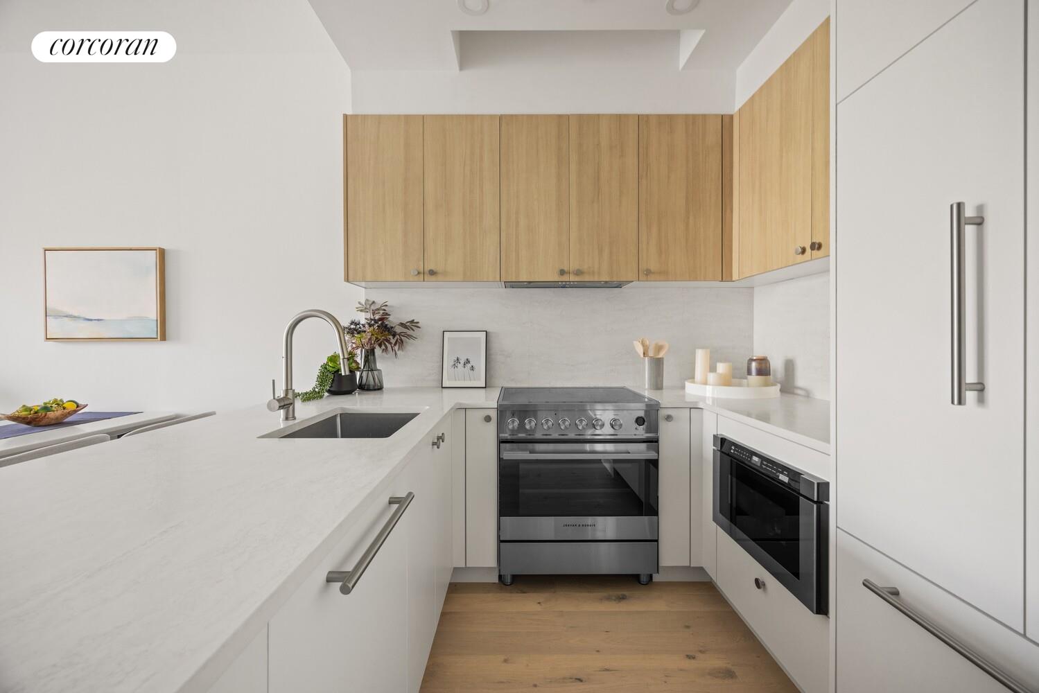 48 Stanhope Street, Unit 3R Brooklyn, NY 11221 - Photo 2 of 9 a kitchen with stainless steel appliances a stove a sink and a refrigerator