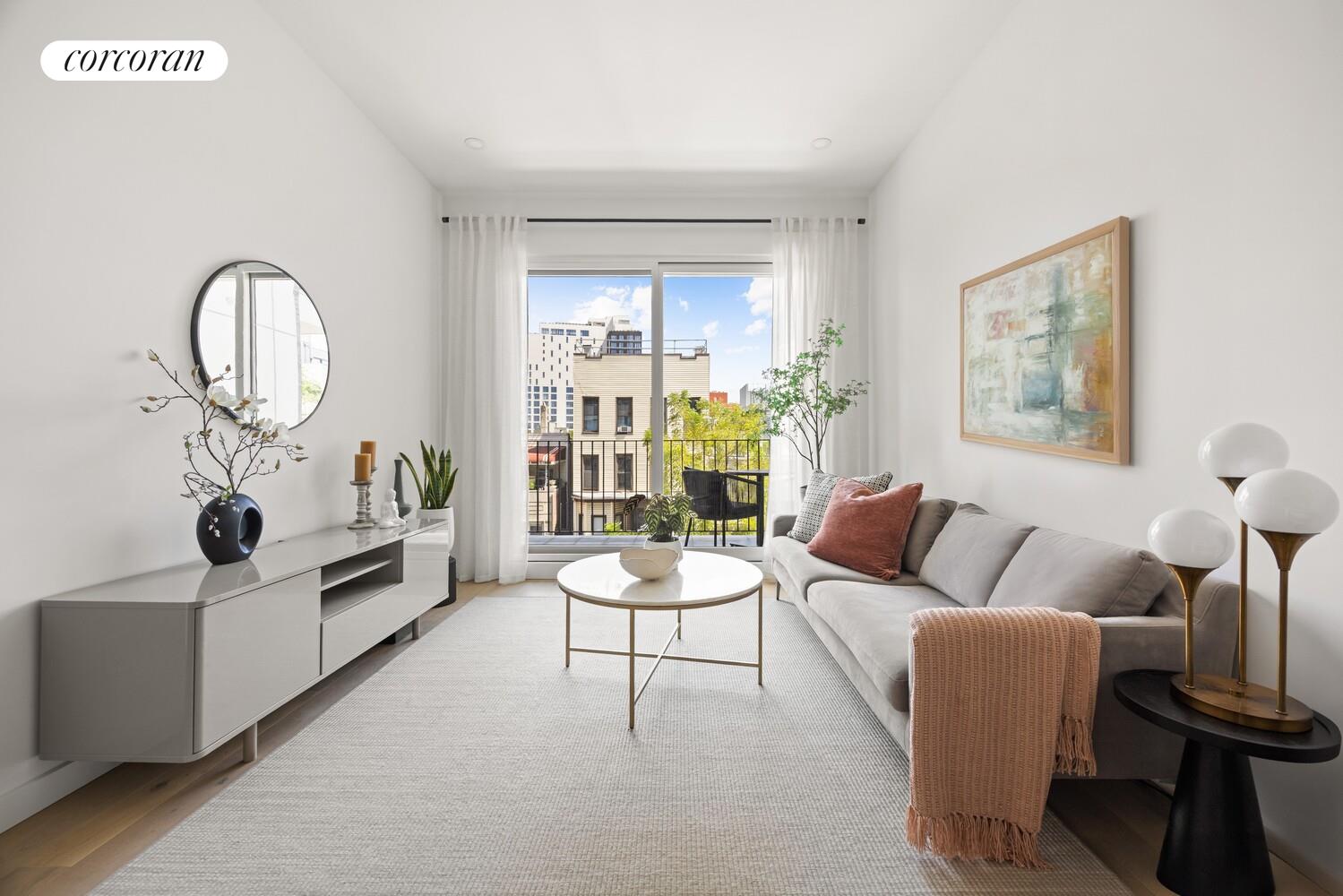 48 Stanhope Street, Unit 3R Brooklyn, NY 11221 - Photo 4 of 9 a living room with furniture and a large window