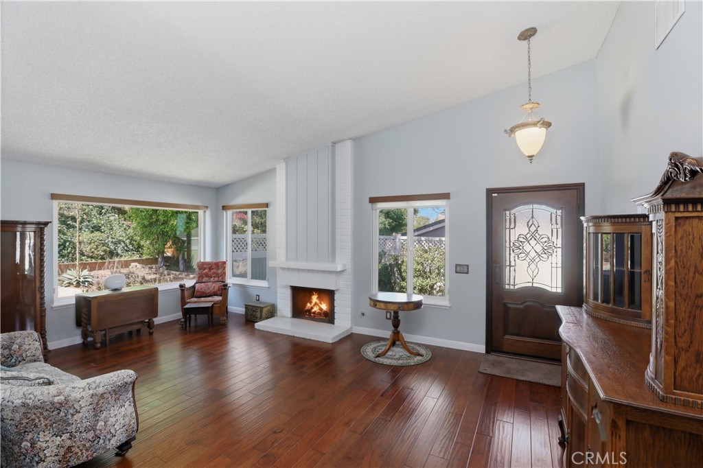 1340 Cadwell Court Riverside, CA 92506 - Photo 12 of 63 a living room with furniture and a fireplace or wooden floor
