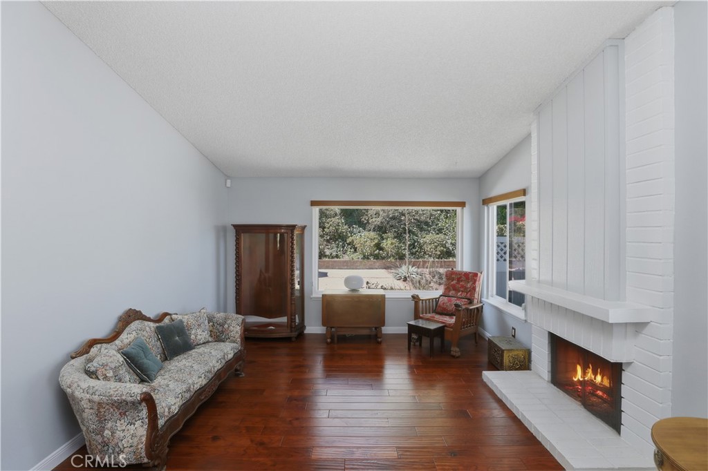 1340 Cadwell Court Riverside, CA 92506 - Photo 14 of 63 a living room with furniture and a fireplace
