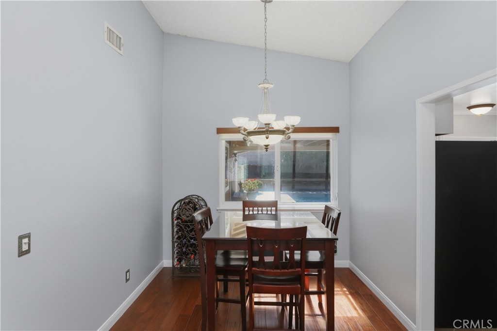 1340 Cadwell Court Riverside, CA 92506 - Photo 18 of 63 a view of a dining room with furniture and chandelier