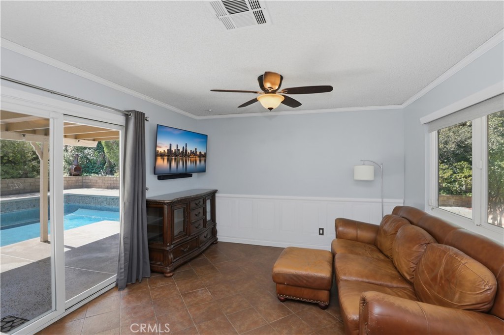 1340 Cadwell Court Riverside, CA 92506 - Photo 23 of 63 a living room with furniture and a flat screen tv
