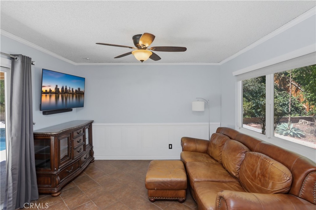 1340 Cadwell Court Riverside, CA 92506 - Photo 24 of 63 a living room with furniture and a flat screen tv