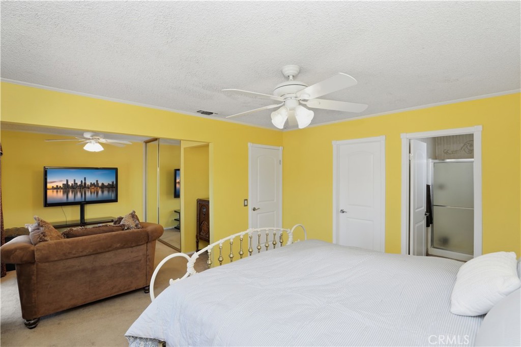 1340 Cadwell Court Riverside, CA 92506 - Photo 28 of 63 a bed room with a bed and a couch