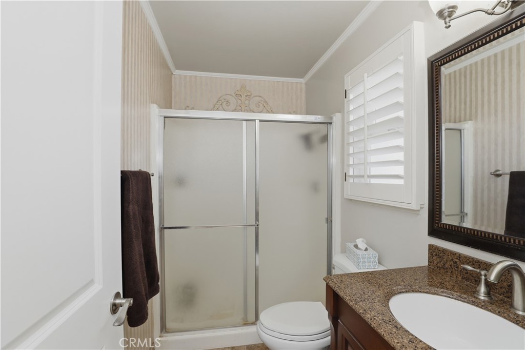 1340 Cadwell Court Riverside, CA 92506 - Photo 30 of 63 a bathroom with a granite countertop sink toilet and shower