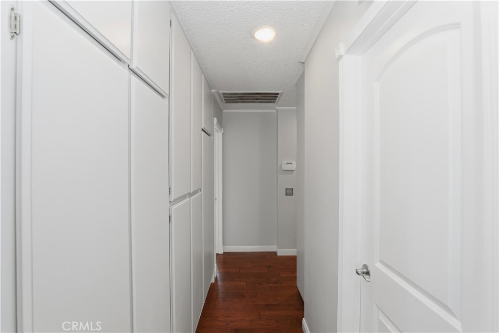 1340 Cadwell Court Riverside, CA 92506 - Photo 32 of 63 a view of a hallway with a wooden door