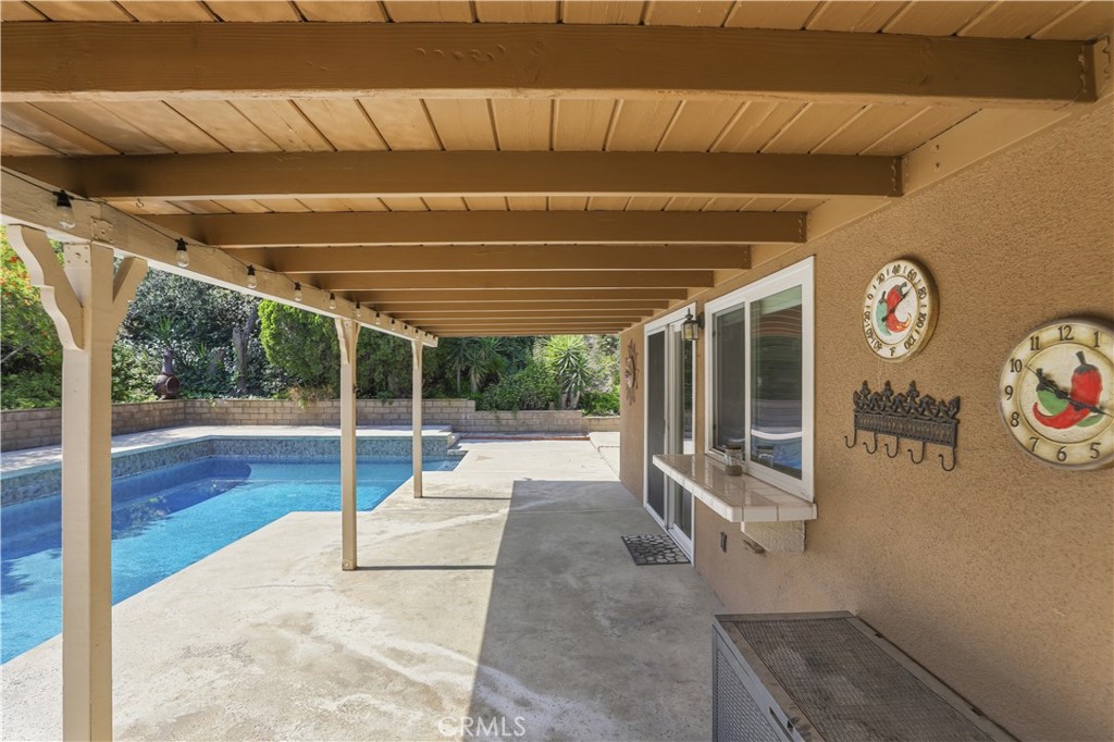 1340 Cadwell Court Riverside, CA 92506 - Photo 39 of 63 a view of a room with wooden floor and iron fence