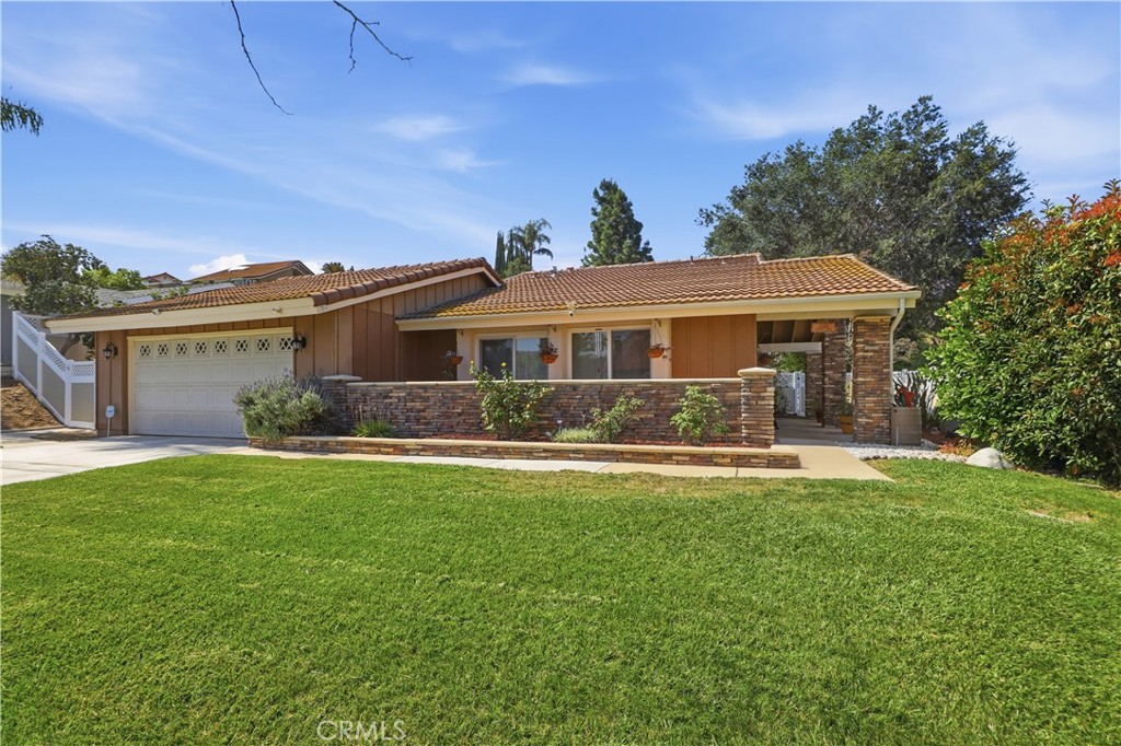 1340 Cadwell Court Riverside, CA 92506 - Photo 60 of 63 a view of a house with a yard patio and a garden