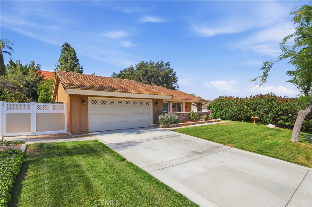 1340 Cadwell Court Riverside, CA 92506 - Photo 62 of 63 a front view of a house with a yard and garage