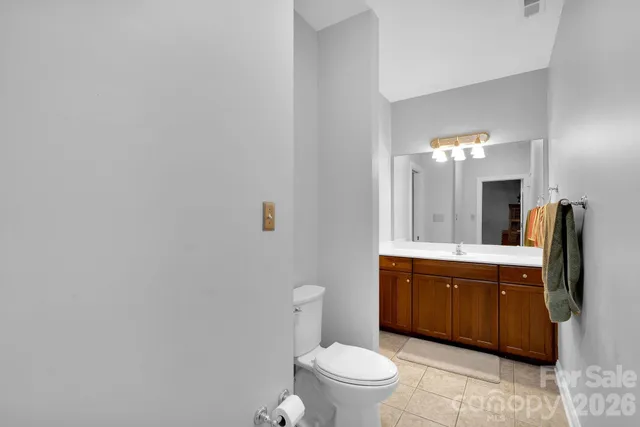 a spacious bathroom with a sink a large mirror and a bathtub