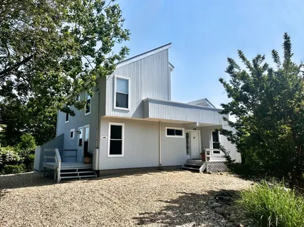 a house with a tree in front of it