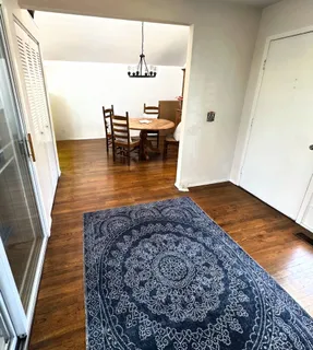 a view of kitchen and dining room with wooden floor
