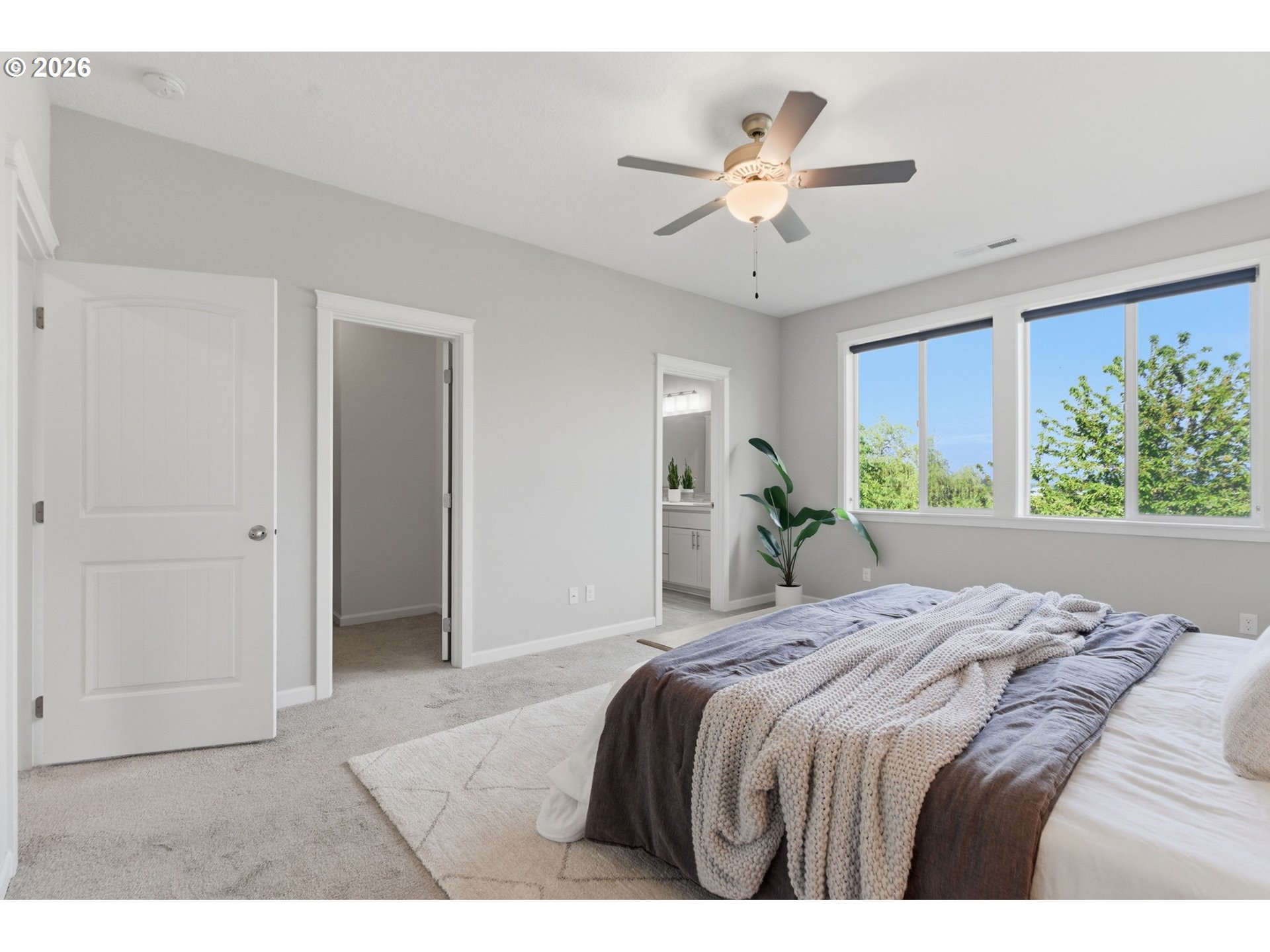 33068 Northwest Ej Smith Road Scappoose, OR 97056 - Photo 22 of 43 a bedroom with a large bed and a chandelier