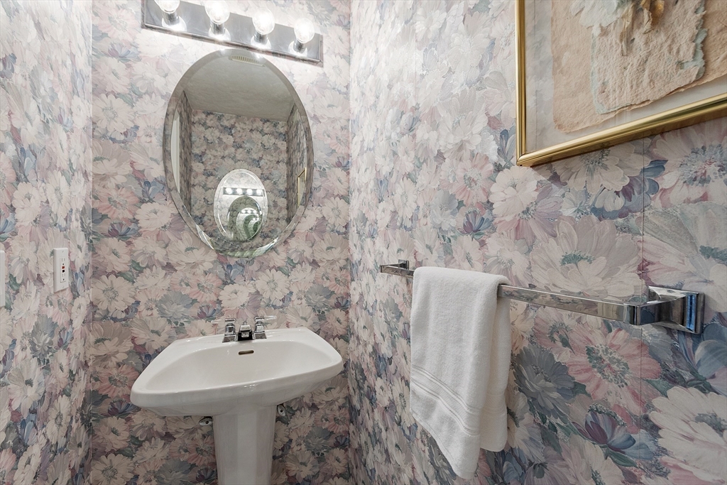 34 Pickman Drive Bedford, MA 01730 - Photo 15 of 38 a bathroom with a sink and mirror