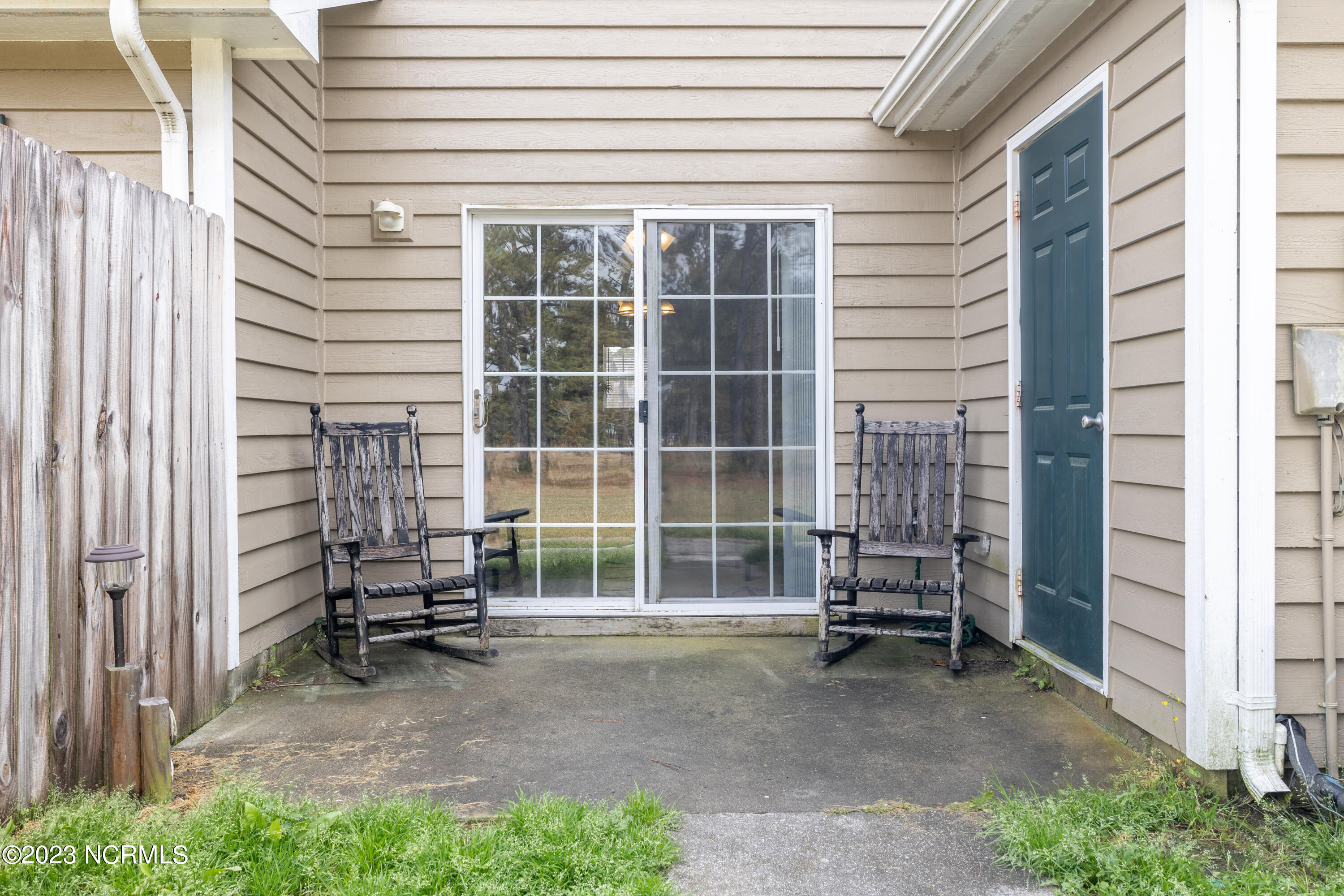 601 Peletier Loop Road, Unit E27 Swansboro, NC 28584 - Photo 11 of 17 Rear Patio located off Living Room with Storage Closet