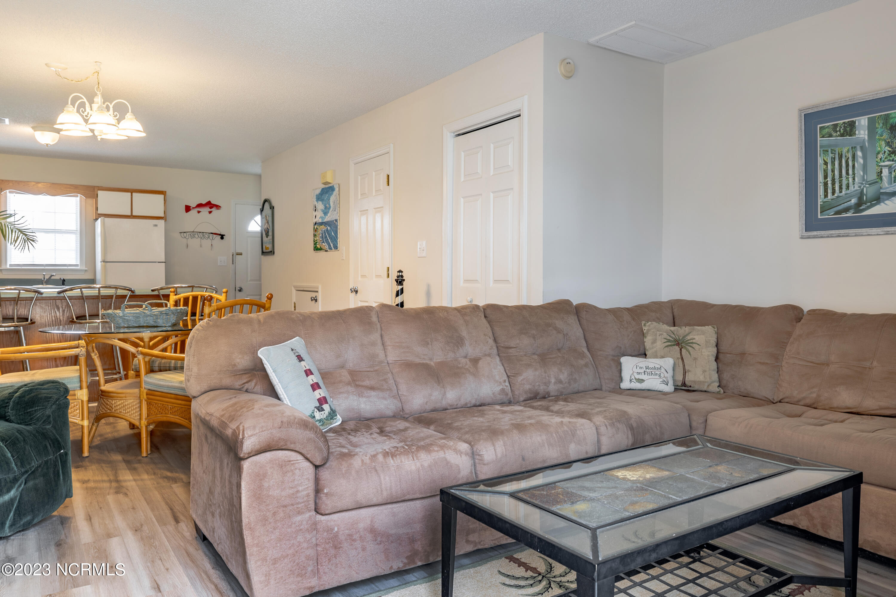 601 Peletier Loop Road, Unit E27 Swansboro, NC 28584 - Photo 8 of 17 View from Living Room to Kitchen