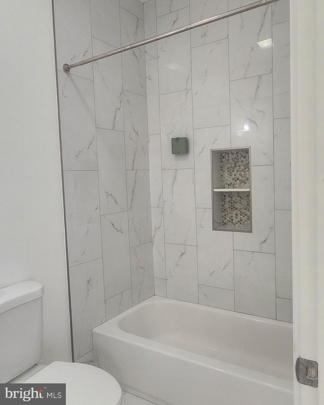 2230 Christian Street, Unit 3 Philadelphia, PA 19146 - Photo 12 of 16 a bathroom with a toilet and a bathtub
