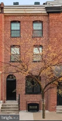 2230 Christian Street, Unit 3 Philadelphia, PA 19146 - Photo 2 of 16 a brick building with a door and a window