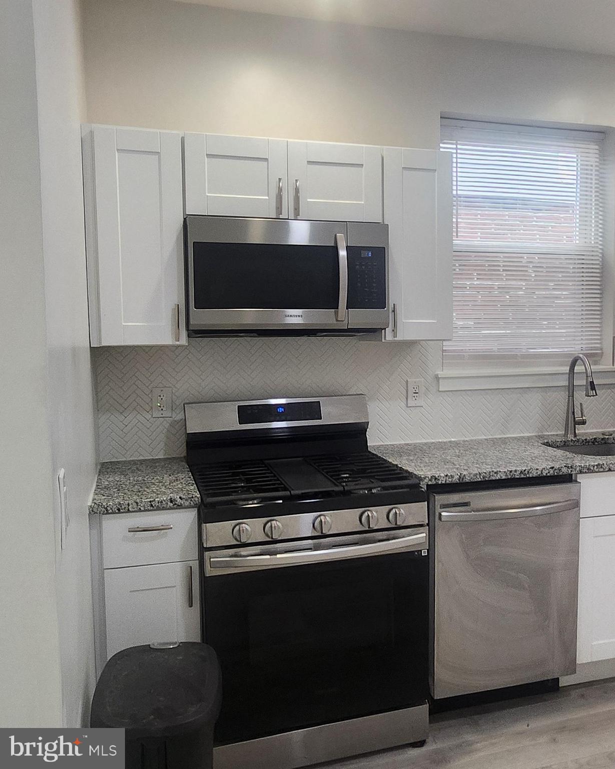 2230 Christian Street, Unit 3 Philadelphia, PA 19146 - Photo 4 of 16 a kitchen with cabinets and steel stainless steel appliances
