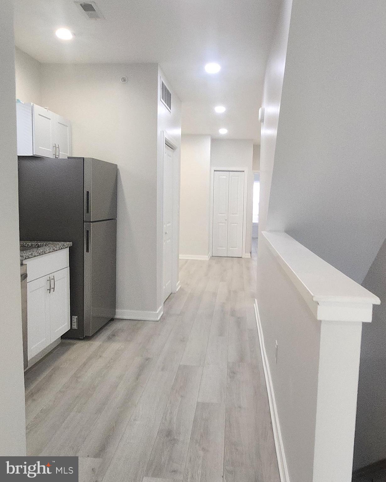 2230 Christian Street, Unit 3 Philadelphia, PA 19146 - Photo 5 of 16 a view of a kitchen with refrigerator and microwave