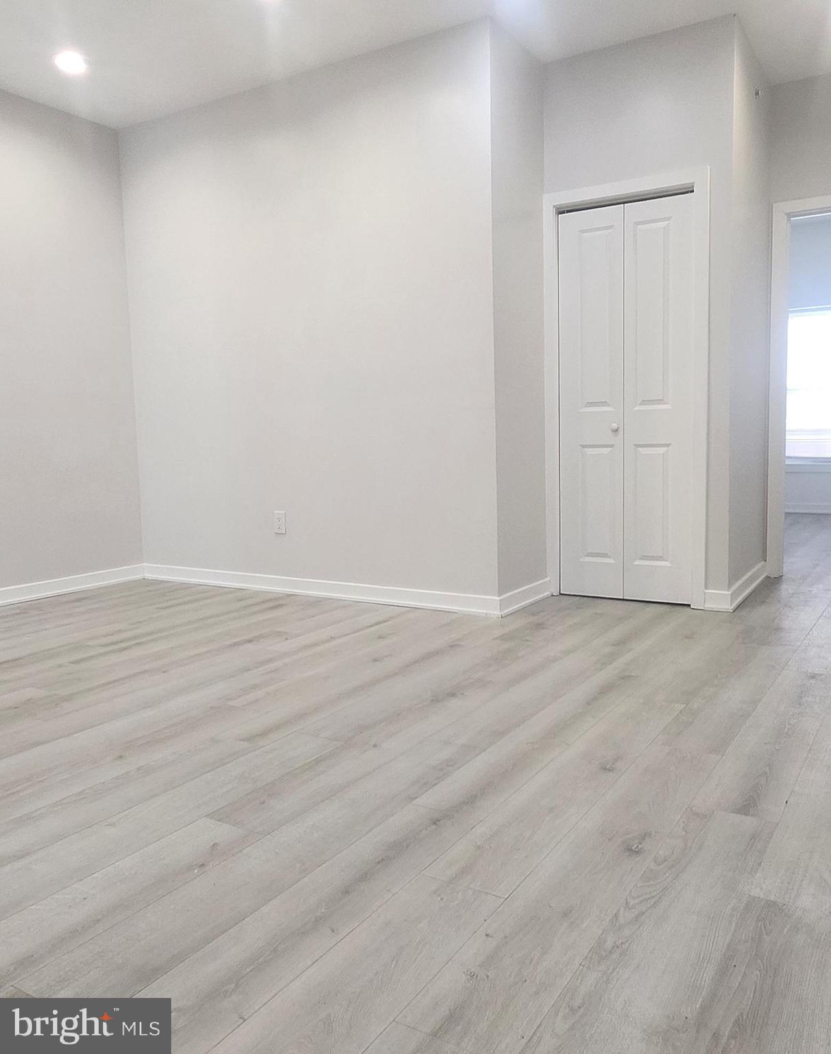 2230 Christian Street, Unit 3 Philadelphia, PA 19146 - Photo 8 of 16 an empty room with wooden floor