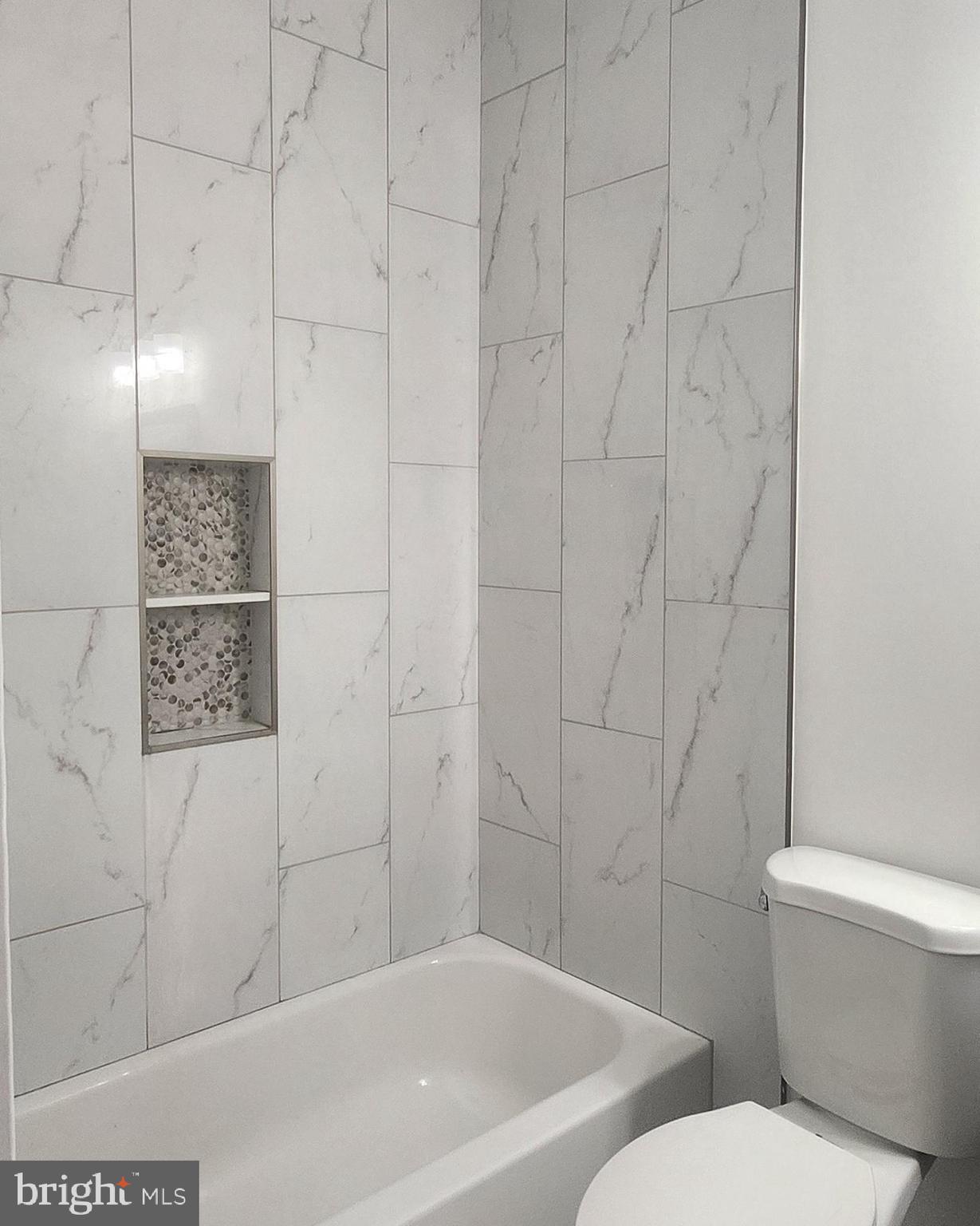 2230 Christian Street, Unit 3 Philadelphia, PA 19146 - Photo 10 of 16 a bathroom with a toilet and a shower