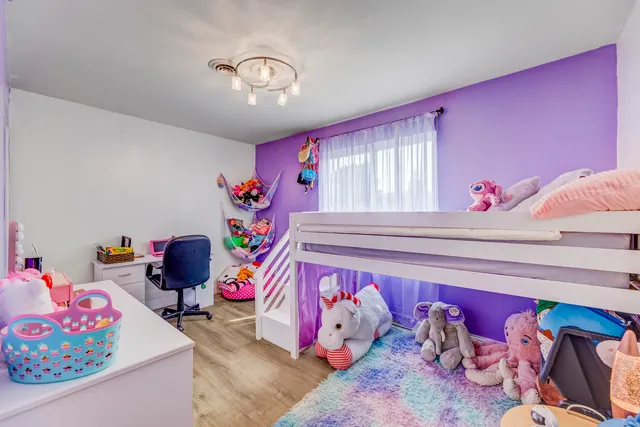 a bedroom with furniture and a bed