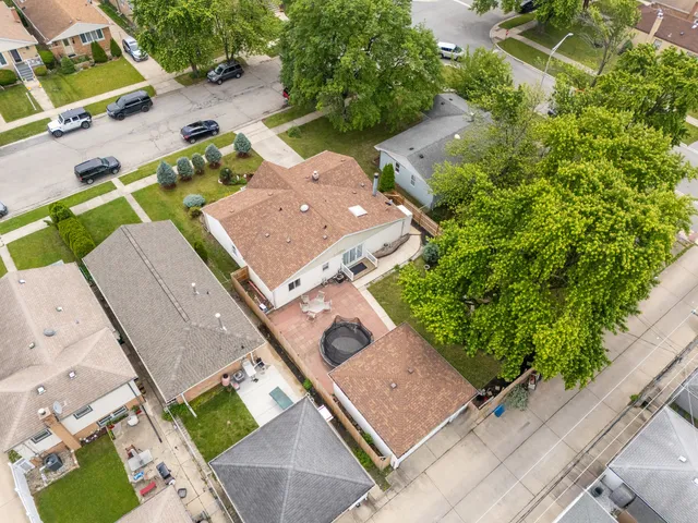 an aerial view of a house with a garden